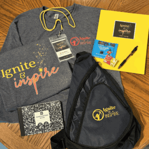 An Ignite and Inspire event kit: printed sweatshirt, lanyard, sling bag, notebook and pen