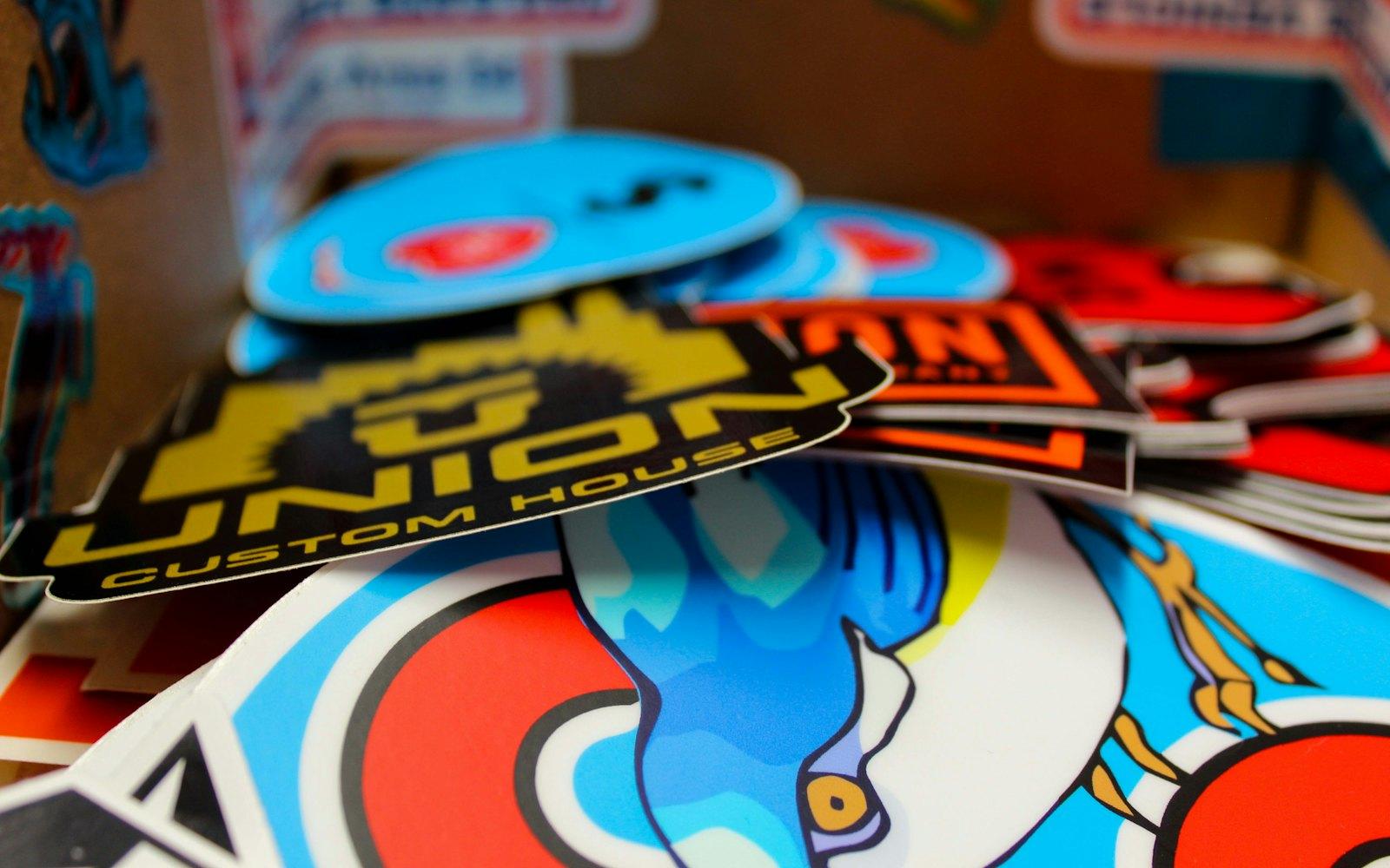 A stack of full-colour die-cut vinyl stickers